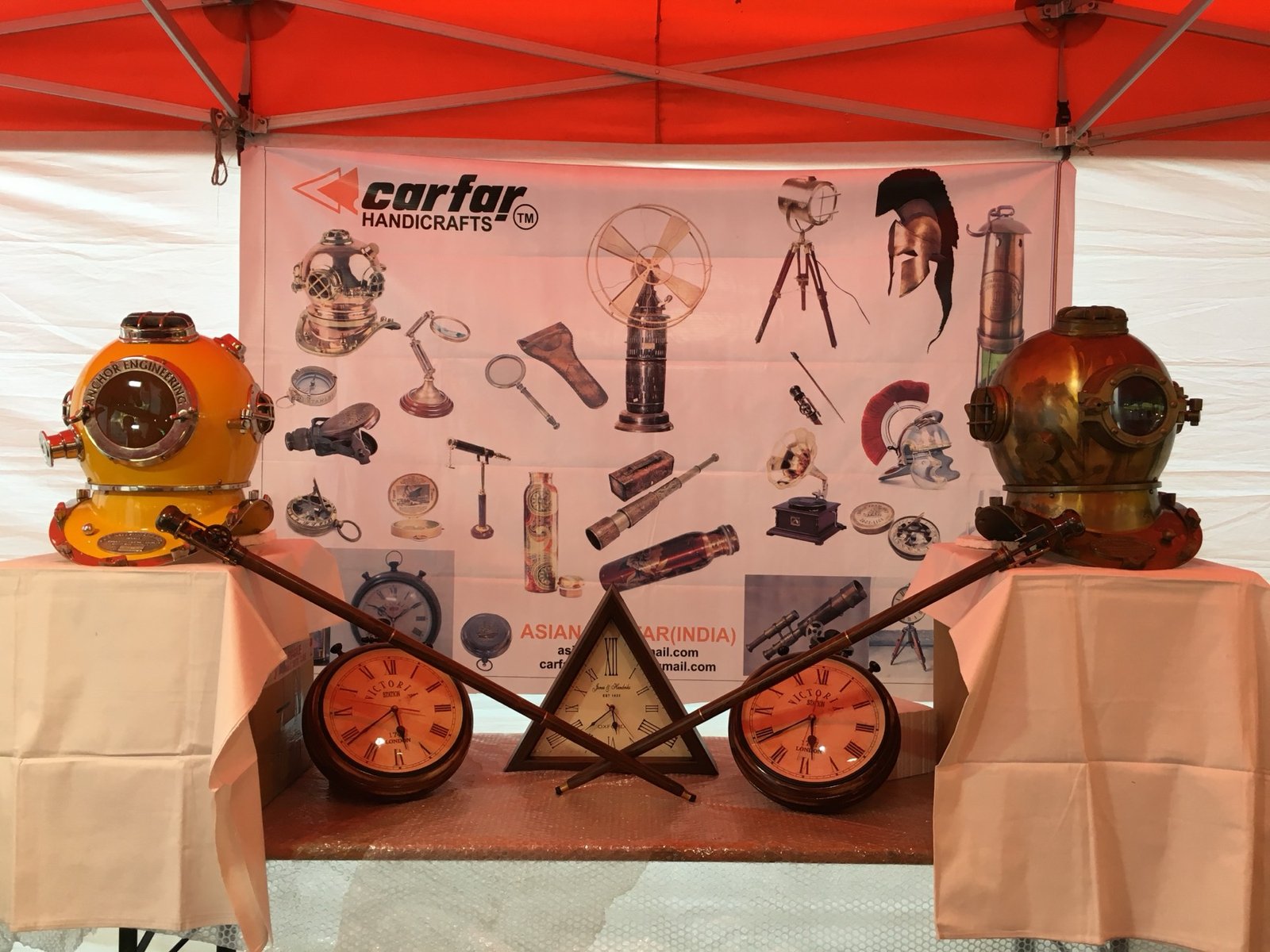 Decorative diving helmets, clocks and telescopes on the Carfar stand
