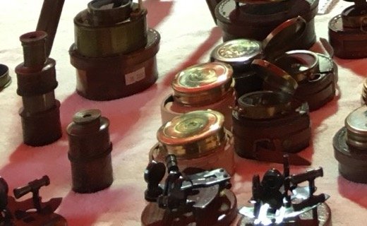 Brass pocket compasses in wooden boxes
