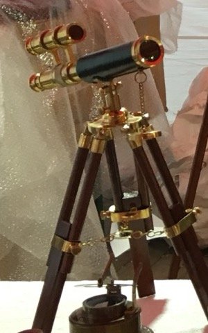 Brass telescopes on wooden tripods